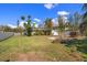 Expansive backyard with lush green lawn and mature trees, perfect for outdoor activities at 746 30Th N Ave, St Petersburg, FL 33704