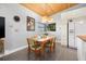 Cozy dining area with a wooden table set, complemented by a view from the window at 746 30Th N Ave, St Petersburg, FL 33704