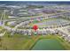 Scenic aerial view of a residential area, showcasing the home's proximity to lakes and community amenities at 8658 Parsons Hill Blvd, Wesley Chapel, FL 33545