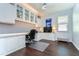 Well lit home office with built-in cabinets and shelving at 9511 Laurel Ledge Dr, Riverview, FL 33569