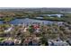 Scenic aerial view of a waterfront community with lush greenery, a body of water, and residential homes at 992 San Carlos Ne Ct, St Petersburg, FL 33702