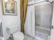 Bathroom featuring toilet, shower-tub combo, and a neutral color scheme at 992 San Carlos Ne Ct, St Petersburg, FL 33702