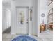 Bright foyer with a decorative door, tiled floor, and view into the adjacent living spaces at 992 San Carlos Ne Ct, St Petersburg, FL 33702