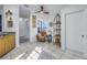 Hallway featuring a sitting area with natural light, tile flooring, and decorative elements at 992 San Carlos Ne Ct, St Petersburg, FL 33702