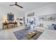 Cozy living room featuring comfortable white furniture, tile floors and a large area rug at 992 San Carlos Ne Ct, St Petersburg, FL 33702