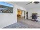 Bright living room featuring tile floors, open archway, desk and large screen television at 992 San Carlos Ne Ct, St Petersburg, FL 33702