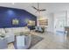 Open-concept living space with white sofa, modern decor, and tiled flooring throughout at 992 San Carlos Ne Ct, St Petersburg, FL 33702