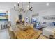Open-concept living space featuring a dining area, kitchen, and living room with high ceilings at 992 San Carlos Ne Ct, St Petersburg, FL 33702