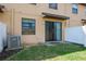 Backyard with a small patio and vinyl fence at 10249 Villa Palazzo Ct, Tampa, FL 33615
