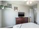 Bedroom with a flat-screen TV and hanging plants for decor at 10249 Villa Palazzo Ct, Tampa, FL 33615