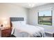 Bright bedroom features a large window and modern decor at 10249 Villa Palazzo Ct, Tampa, FL 33615