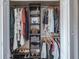 Organized closet with shelves, hanging rods, clothing, shoes, and accessories at 10249 Villa Palazzo Ct, Tampa, FL 33615