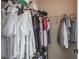 Walk-in closet with metal shelving, a hanging rod, shoes, and clothing at 10249 Villa Palazzo Ct, Tampa, FL 33615