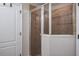 Modern tiled shower with glass door, adding elegance and functionality to the bathroom at 10249 Villa Palazzo Ct, Tampa, FL 33615