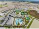 Panoramic aerial view of the community showcasing the pool, amenities and houses at 10389 Echo Dock Loop, San Antonio, FL 33576