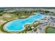 Aerial view of a beautiful turquoise lagoon with sandy beach access in a stunning community at 10389 Echo Dock Loop, San Antonio, FL 33576