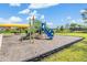Community playground featuring a slide and climbing area with mature trees and covered seating at 10389 Echo Dock Loop, San Antonio, FL 33576