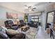 Comfortable living room with tile floors, ceiling fan and neutral paint at 10389 Echo Dock Loop, San Antonio, FL 33576