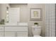 Bright bathroom with a white vanity, clean lines, neutral wall decor, and a shower with a decorative curtain at 106 Lilyan Ct, Rotonda West, FL 33947