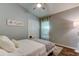 Bedroom features a vaulted ceiling, window with sheer curtains, and decor for a serene retreat at 11207 Cypress Reserve Dr, Tampa, FL 33626