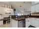 Stylish kitchen with stainless steel dishwasher, granite countertops, and a view to the dining area at 11207 Cypress Reserve Dr, Tampa, FL 33626