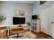 Well-organized home office with a large monitor, ample storage, and stylish decor at 11207 Cypress Reserve Dr, Tampa, FL 33626