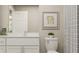 Bright bathroom featuring white cabinets, a modern vanity, and stylish fixtures at 114 Lilyan Ct, Rotonda West, FL 33947