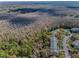 Aerial view of condos close to beautiful wooded area at 1182 Pine Ridge W Cir # B1, Tarpon Springs, FL 34688