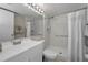 Well-lit bathroom with a shower, and modern sink at 1182 Pine Ridge W Cir # B1, Tarpon Springs, FL 34688