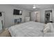 Bright bedroom with a comfortable bed, ensuite bathroom, and walk-in closet at 1182 Pine Ridge W Cir # B1, Tarpon Springs, FL 34688