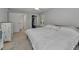 This bedroom features a comfortable bed, ensuite bathroom, and closet at 1182 Pine Ridge W Cir # B1, Tarpon Springs, FL 34688