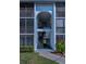 Close-up of condo showing walkway, entrance and screens at 1182 Pine Ridge W Cir # B1, Tarpon Springs, FL 34688