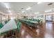 Spacious meeting room with tables, chairs, and natural light at 1182 Pine Ridge W Cir # B1, Tarpon Springs, FL 34688
