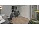 Home office featuring a modern desk, comfortable chairs, and ample workspace at 1182 Pine Ridge W Cir # B1, Tarpon Springs, FL 34688