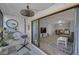 Sliding glass doors open to the living room, patio area at 1182 Pine Ridge W Cir # B1, Tarpon Springs, FL 34688