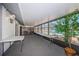Bright sunroom with tile flooring and a view of the pool at 1182 Pine Ridge W Cir # B1, Tarpon Springs, FL 34688