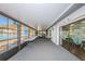 Enclosed sunroom with views of the outdoor pool area at 1182 Pine Ridge W Cir # B1, Tarpon Springs, FL 34688