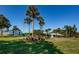 Well-maintained tennis courts surrounded by lush landscaping, highlighting an active lifestyle at 1182 Pine Ridge W Cir # B1, Tarpon Springs, FL 34688