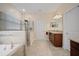 Beautiful bathroom with a separate shower, soaking tub, and double sink vanity at 11965 Cinnamon Fern Dr, Riverview, FL 33579