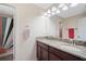 Bathroom with double sinks, granite countertops, and a shower/tub combo at 11965 Cinnamon Fern Dr, Riverview, FL 33579