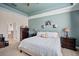Inviting bedroom with an ensuite bathroom entrance, bedside tables, and ample natural light at 11965 Cinnamon Fern Dr, Riverview, FL 33579