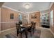 Dining room featuring built-in shelving and dark wood dining table at 11965 Cinnamon Fern Dr, Riverview, FL 33579