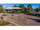 A community playground has swings, slides, and other fun features for residents to enjoy at 11965 Cinnamon Fern Dr, Riverview, FL 33579
