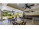 This outdoor lounge has a bar-style countertop for refreshments near the pool and lounge chairs at 11965 Cinnamon Fern Dr, Riverview, FL 33579