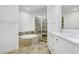This bathroom boasts a soaking tub, a walk-in shower, and a large vanity, all beautifully tiled at 1209 E Cumberland Ave # 1703, Tampa, FL 33602