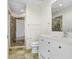 Bathroom with a sleek, white vanity, tile floor, and a glass-enclosed shower for a modern feel at 1209 E Cumberland Ave # 1703, Tampa, FL 33602