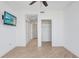 Bedroom with ceiling fan, wood floors, and view to other rooms at 1209 E Cumberland Ave # 1703, Tampa, FL 33602