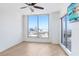 Bedroom featuring a ceiling fan, windows, and city views at 1209 E Cumberland Ave # 1703, Tampa, FL 33602