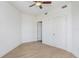 Bright bedroom with light wood floors and neutral walls, featuring ample closet space and simple, elegant design at 1209 E Cumberland Ave # 1703, Tampa, FL 33602
