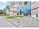 Upscale building entrance with well-maintained landscaping, signage, and convenient street access at 1209 E Cumberland Ave # 1703, Tampa, FL 33602